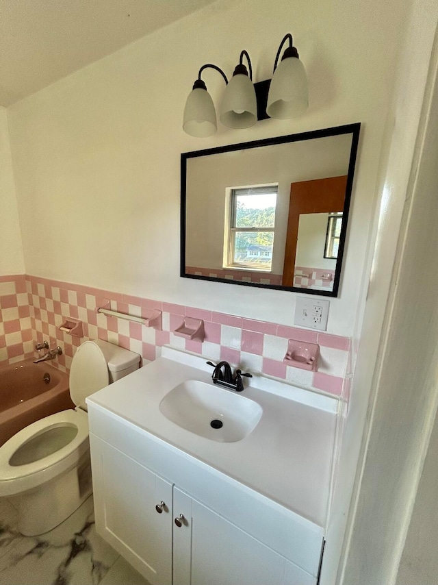 bathroom featuring vanity, tasteful backsplash, tile patterned flooring, toilet, and a bathtub