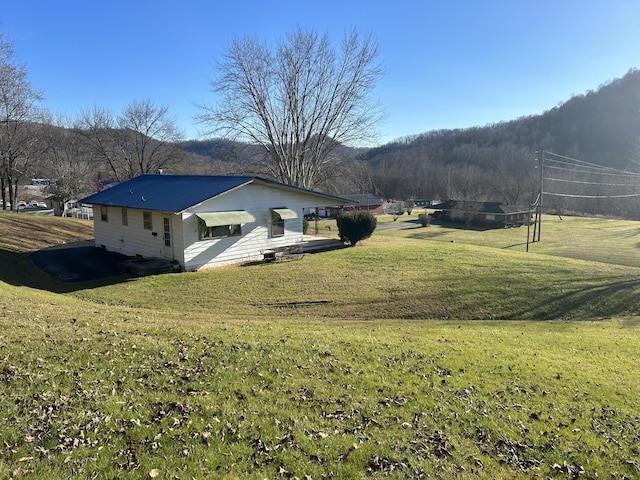 view of property exterior featuring a yard