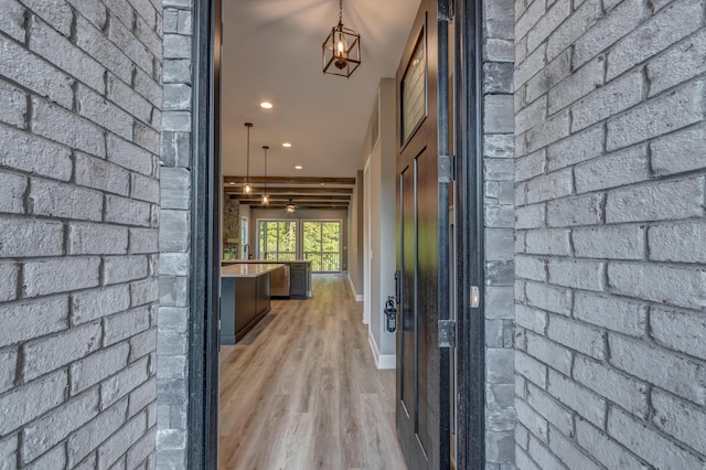 exterior space featuring light wood-type flooring, ceiling fan, baseboards, and recessed lighting