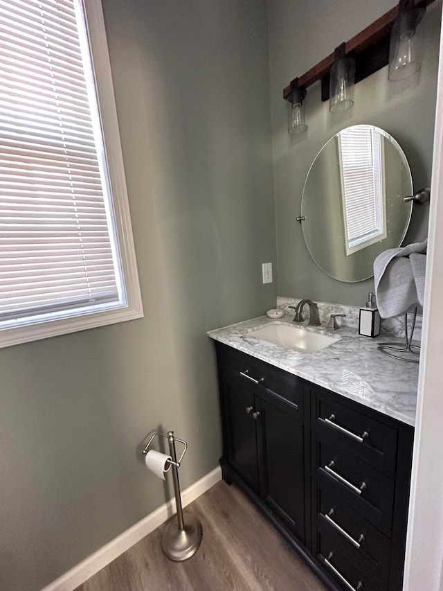 bathroom featuring vanity and hardwood / wood-style floors