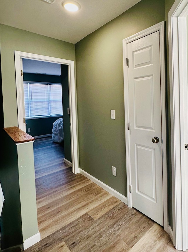 hallway featuring light hardwood / wood-style flooring