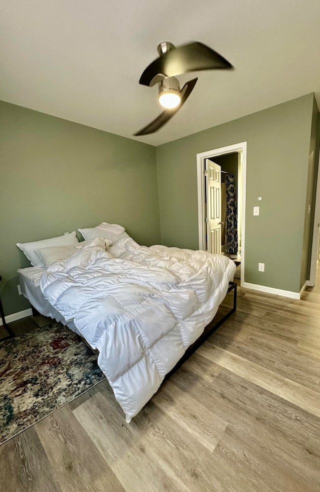 bedroom featuring ceiling fan and light wood-type flooring