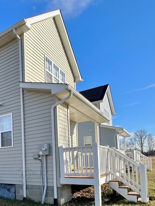 view of side of home with a deck