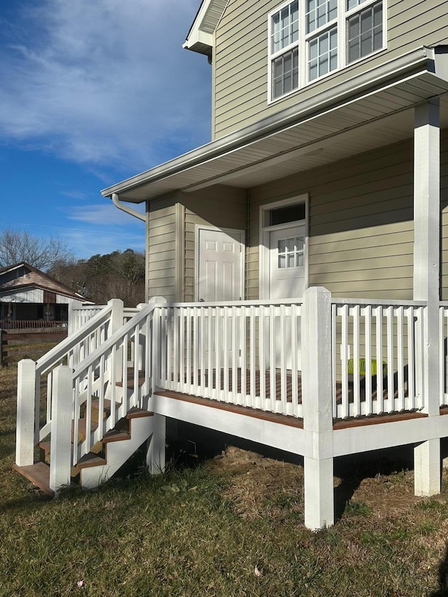 rear view of property with a porch