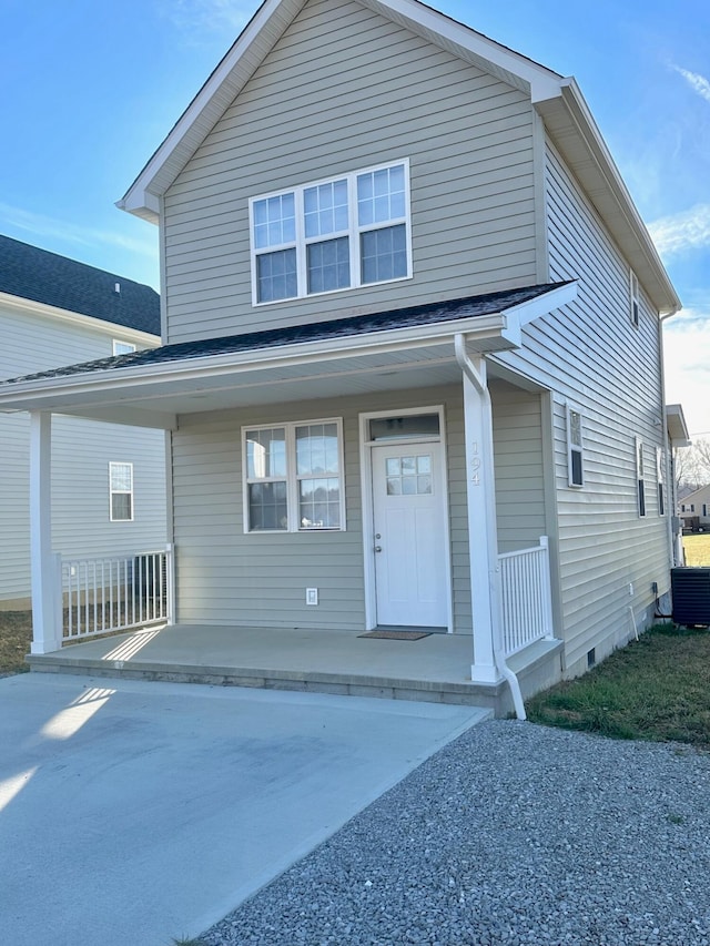 view of front property featuring central AC unit and covered porch