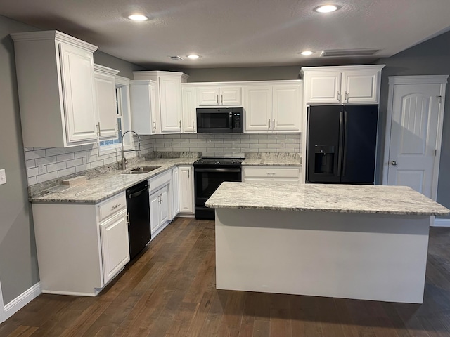 kitchen featuring white cabinets, black appliances, and sink