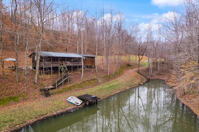 dock area featuring a deck with water view