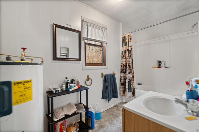 bathroom featuring vanity, water heater, and tile patterned floors