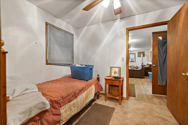 bedroom with hardwood / wood-style floors and ceiling fan