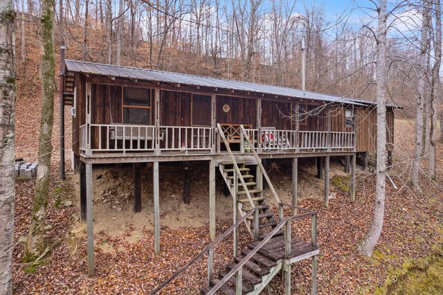 back of property with a wooden deck