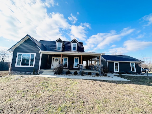 view of front facade featuring a front lawn and covered porch