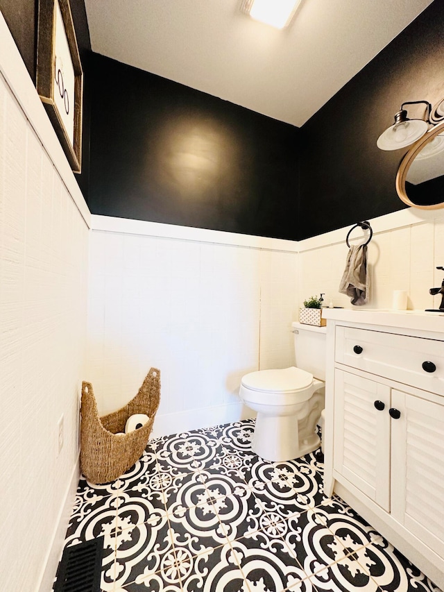 bathroom with vanity and toilet