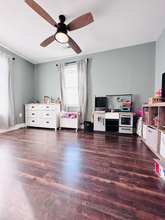 bedroom with ceiling fan and dark hardwood / wood-style floors