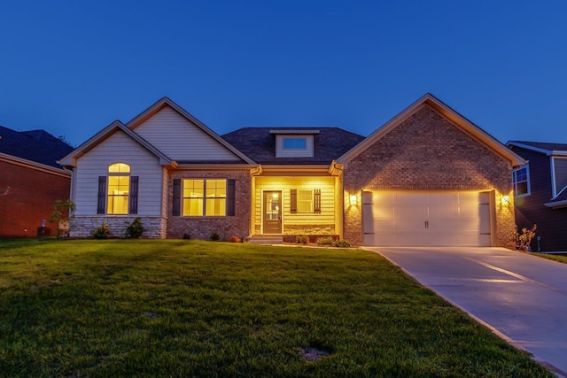 craftsman inspired home featuring a garage and a lawn