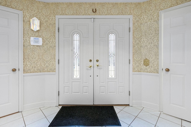 entrance foyer featuring plenty of natural light and light tile floors