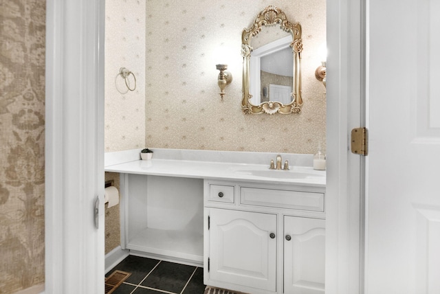 bathroom with tile floors and vanity