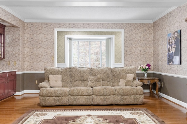 living room with hardwood / wood-style floors and crown molding