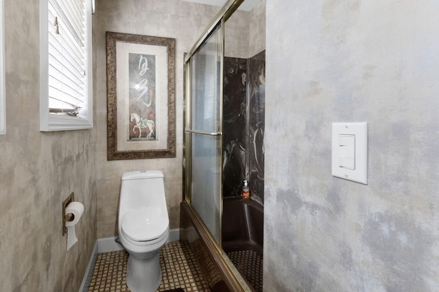 bathroom with tile floors and toilet