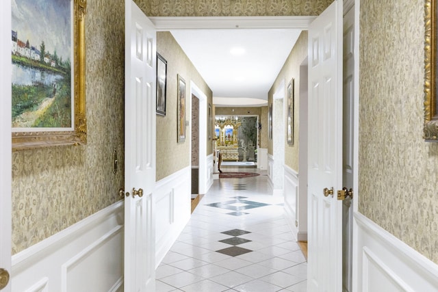 corridor featuring light tile floors