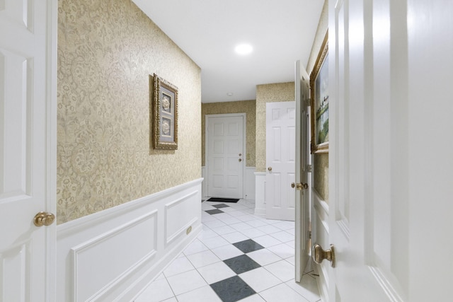 hallway featuring light tile floors