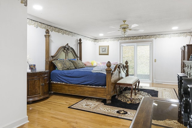 bedroom with ceiling fan, crown molding, and light hardwood / wood-style floors