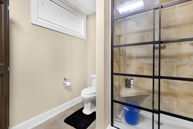 bathroom with toilet and tile floors