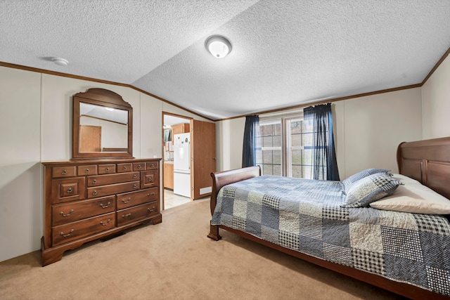 carpeted bedroom featuring lofted ceiling, white fridge, a textured ceiling, ensuite bath, and crown molding