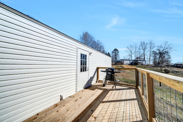 wooden deck with area for grilling