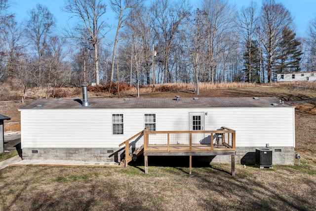 rear view of property featuring central AC unit and a deck