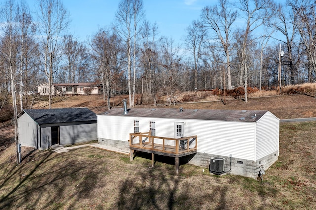 exterior space featuring a deck and central AC unit