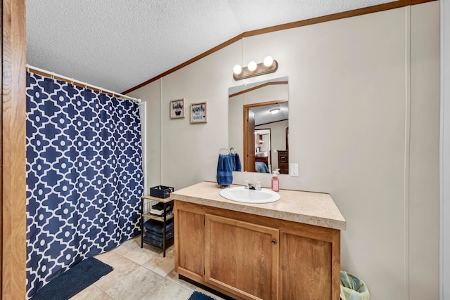 bathroom featuring lofted ceiling, a textured ceiling, tile floors, and vanity