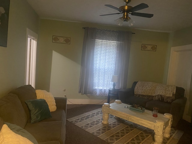 living room with carpet floors and ceiling fan