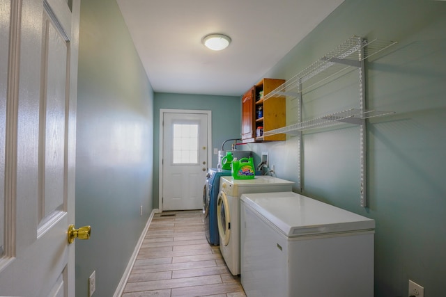 427 Sharpsburg Rd, Sharpsburg, KY 40374 - laundry room featuring baseboards, laundry area, light wood-style floors, and washer and clothes dryer