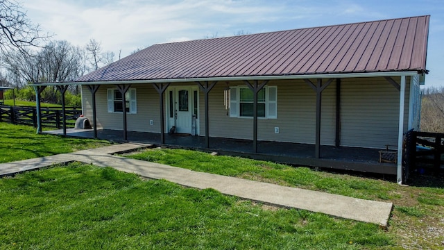427 Sharpsburg Rd, Sharpsburg, KY 40374 - view of front of home featuring a front lawn, metal roof, covered porch, and a standing seam roof