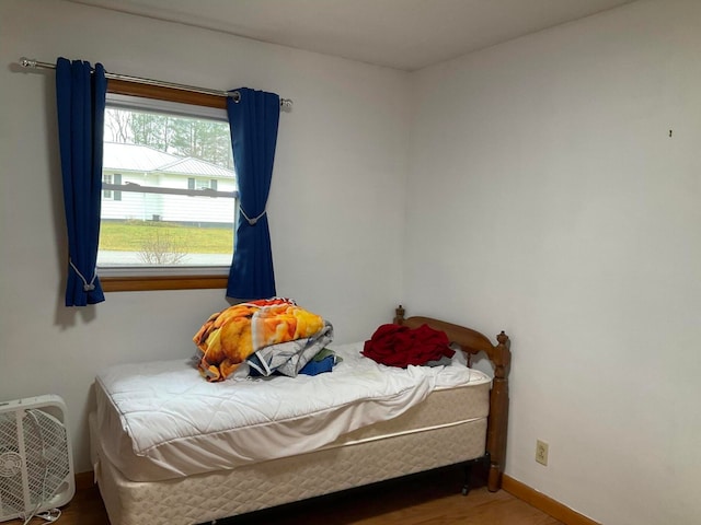 bedroom featuring dark hardwood / wood-style flooring