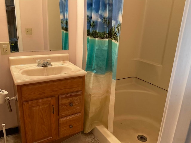 bathroom featuring a shower with curtain, tile flooring, and vanity