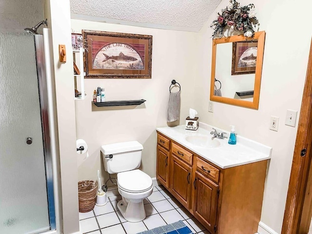 bathroom with tile flooring, a shower with shower door, a textured ceiling, toilet, and vanity