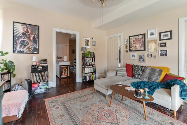 living room with dark hardwood / wood-style flooring