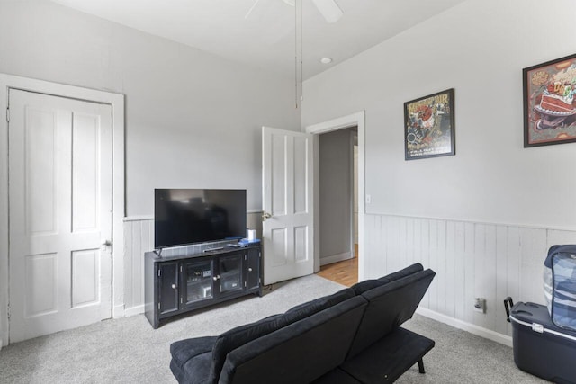 living room with light carpet and ceiling fan