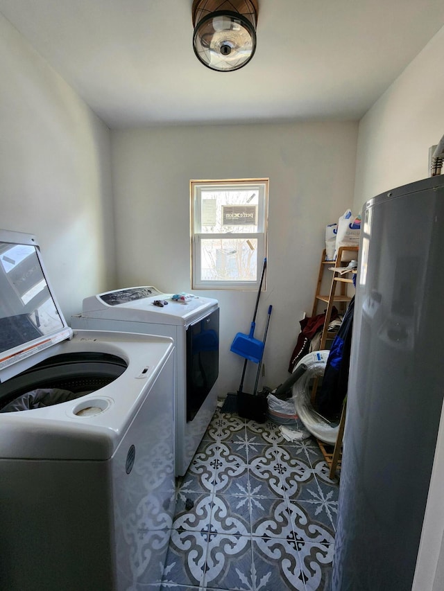 clothes washing area featuring washer and dryer and tile patterned floors