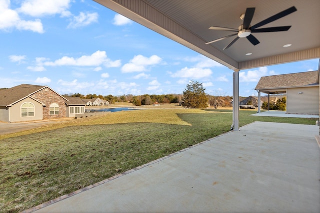 view of yard featuring ceiling fan and a patio area