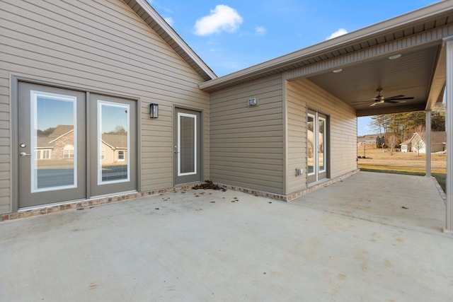 view of patio featuring ceiling fan