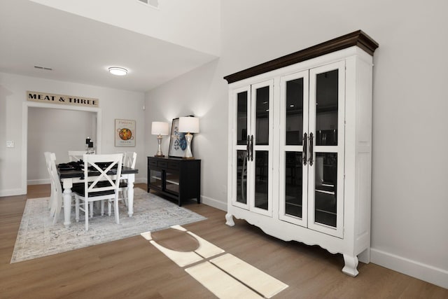 dining area with dark hardwood / wood-style floors