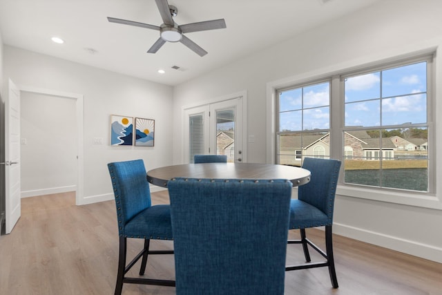 dining area featuring ceiling fan and light hardwood / wood-style flooring