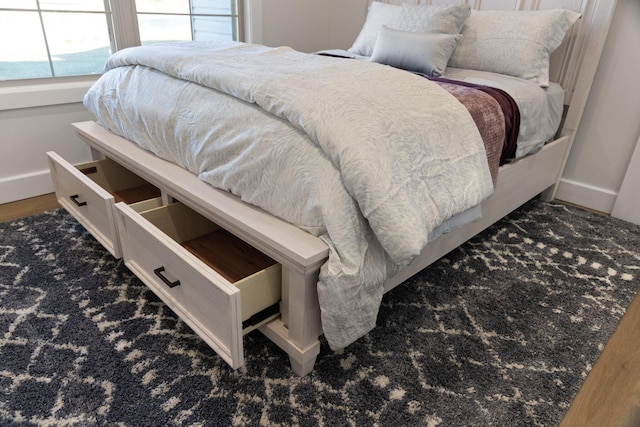 bedroom featuring dark hardwood / wood-style flooring