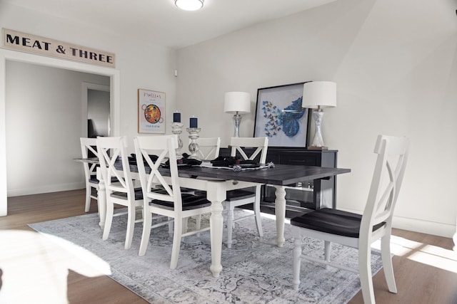 dining space featuring hardwood / wood-style floors