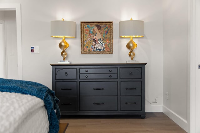 bedroom featuring dark hardwood / wood-style floors