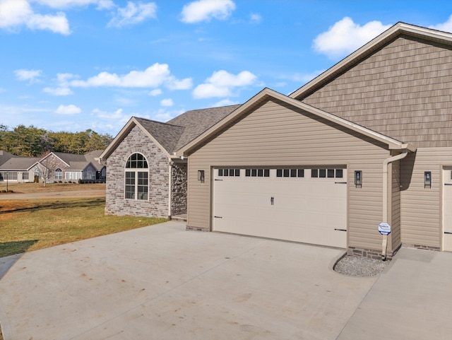 view of front of house with a garage and a front yard