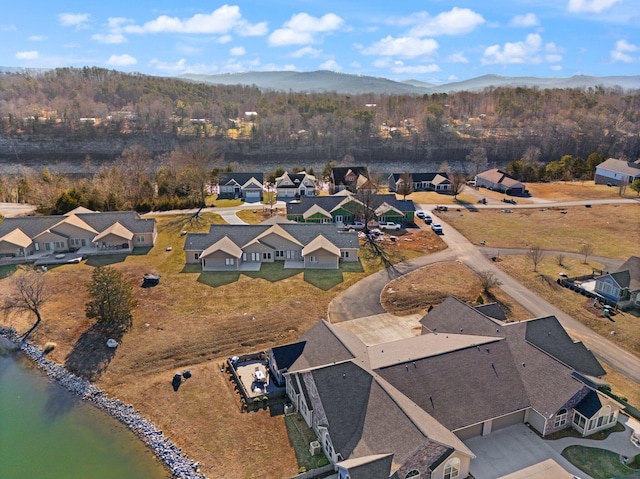 aerial view featuring a water and mountain view