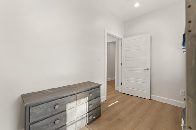 hallway with light wood-type flooring